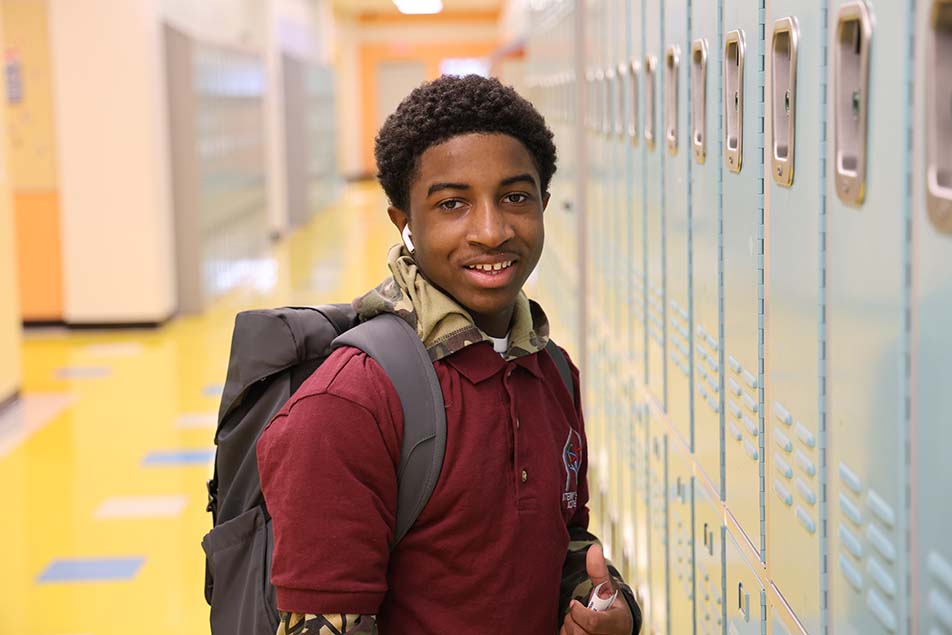 students and teacher working in classroom
